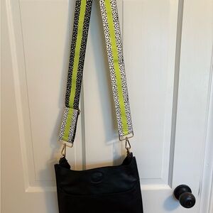 Elegant Black Crossbody Bag with Green Strap
